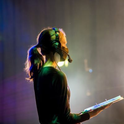 Stage Manager Samantha Liquorish wearing a headset during a rehearsal